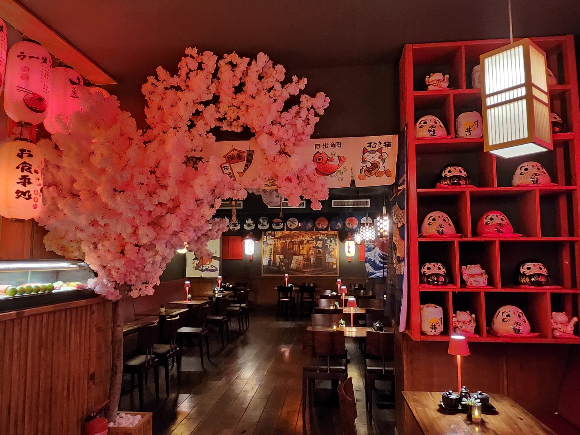 Dim dining room booths with lantern lighting